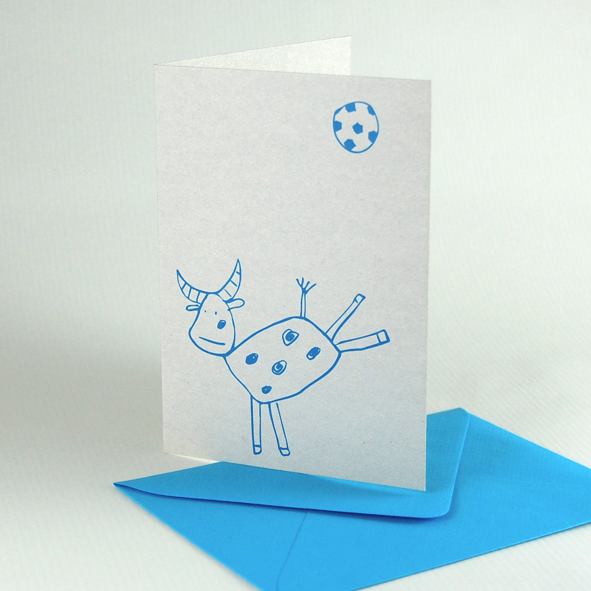 Recycled football cards with turquoise envelopes